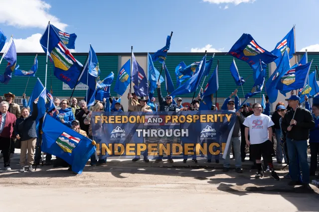 Separatist supporters gather during a rally in front of the Elections Alberta headquarters in Edmonton, Canada, on May 4 as they submit boxes of signatures in the hope of triggering an independence referendum.