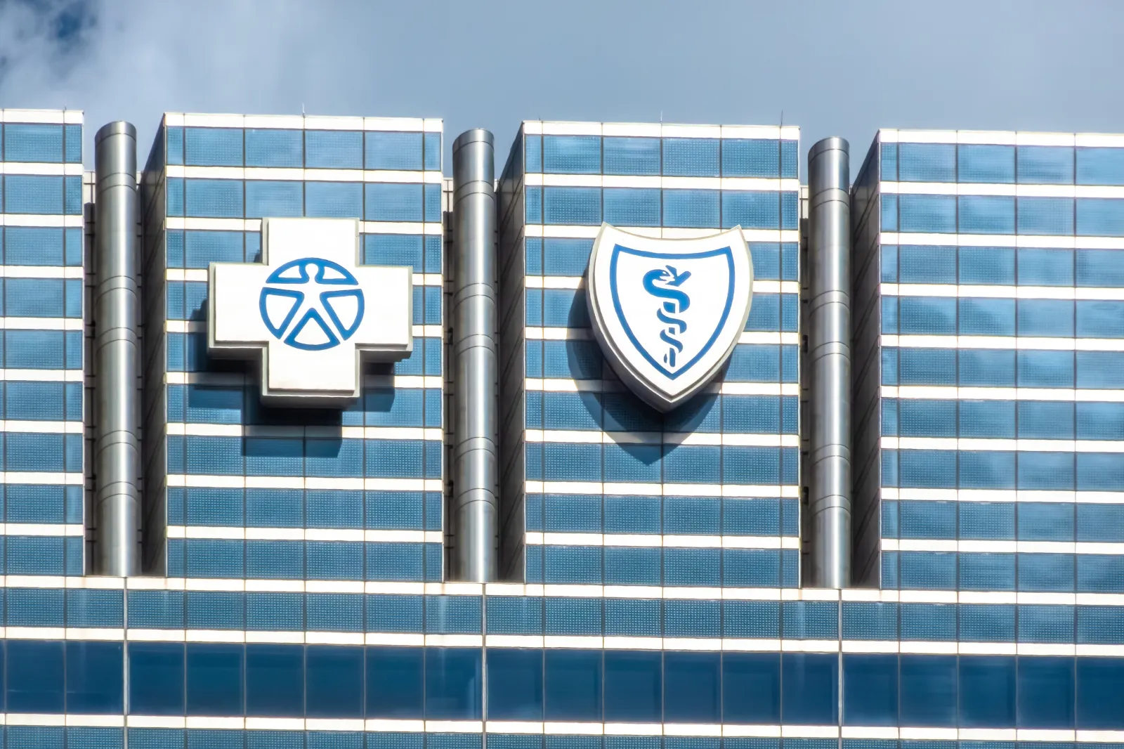 Blue Cross Blue Shield logos on a building in Chicago, Illinois, on September 18, 2025.