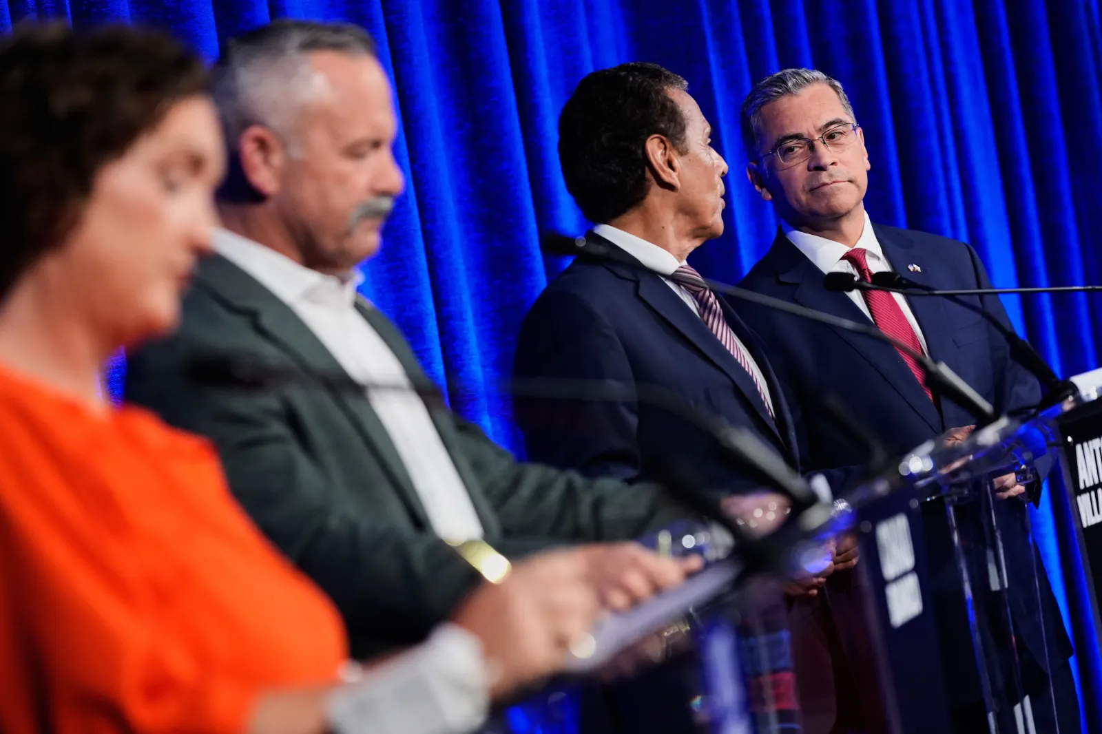 Xavier Becerra, right, listens to Antonio Villaraigosa, second from right, during a break in a California gubernatorial debate hosted by CBS Bay Area and the San Francisco Examiner in San Francisco, Thursday, May 14, 2026.