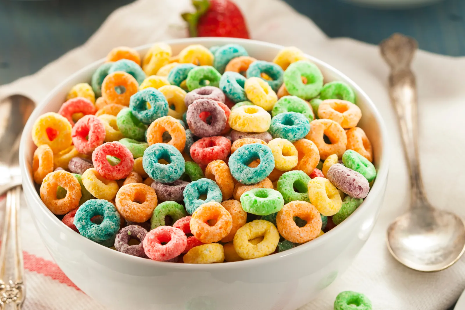 A bowl of colorful fruit cereal loops.
