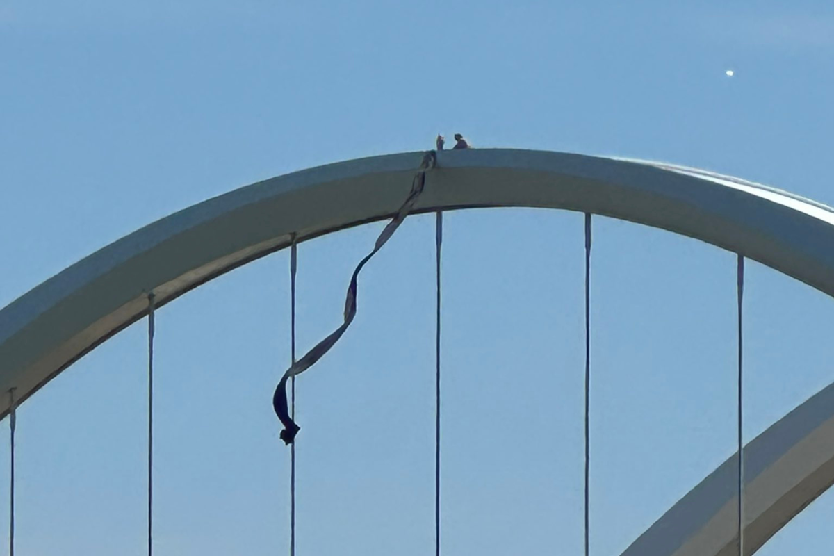 Activist Scales Bridge in Urgent Protest Against War and AI Dangers