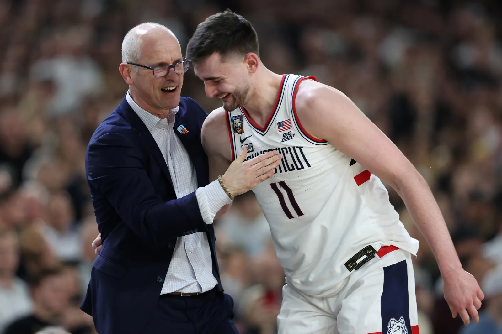 Head coach Dan Hurley and Alex Karaban #11 of the Connecticut Huskies