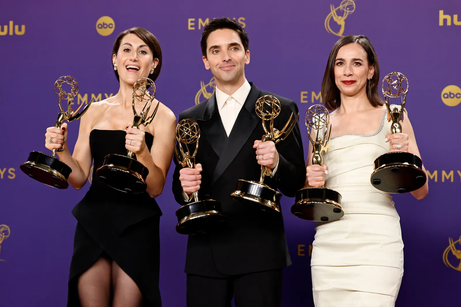 LOS ANGELES, CALIFORNIA - SEPTEMBER 15: (L-R) Jen Statsky, Paul W. Downs, and Lucia Aniello, winners of the Outstanding Comedy Series award and Outstanding Writing for a Comedy Series award for "Hacks" pose in the press room during the 76th Primetime Emmy Awards at Peacock Theater on September 15, 2024 in Los Angeles, California.  (Photo by Frazer Harrison/Getty Images)