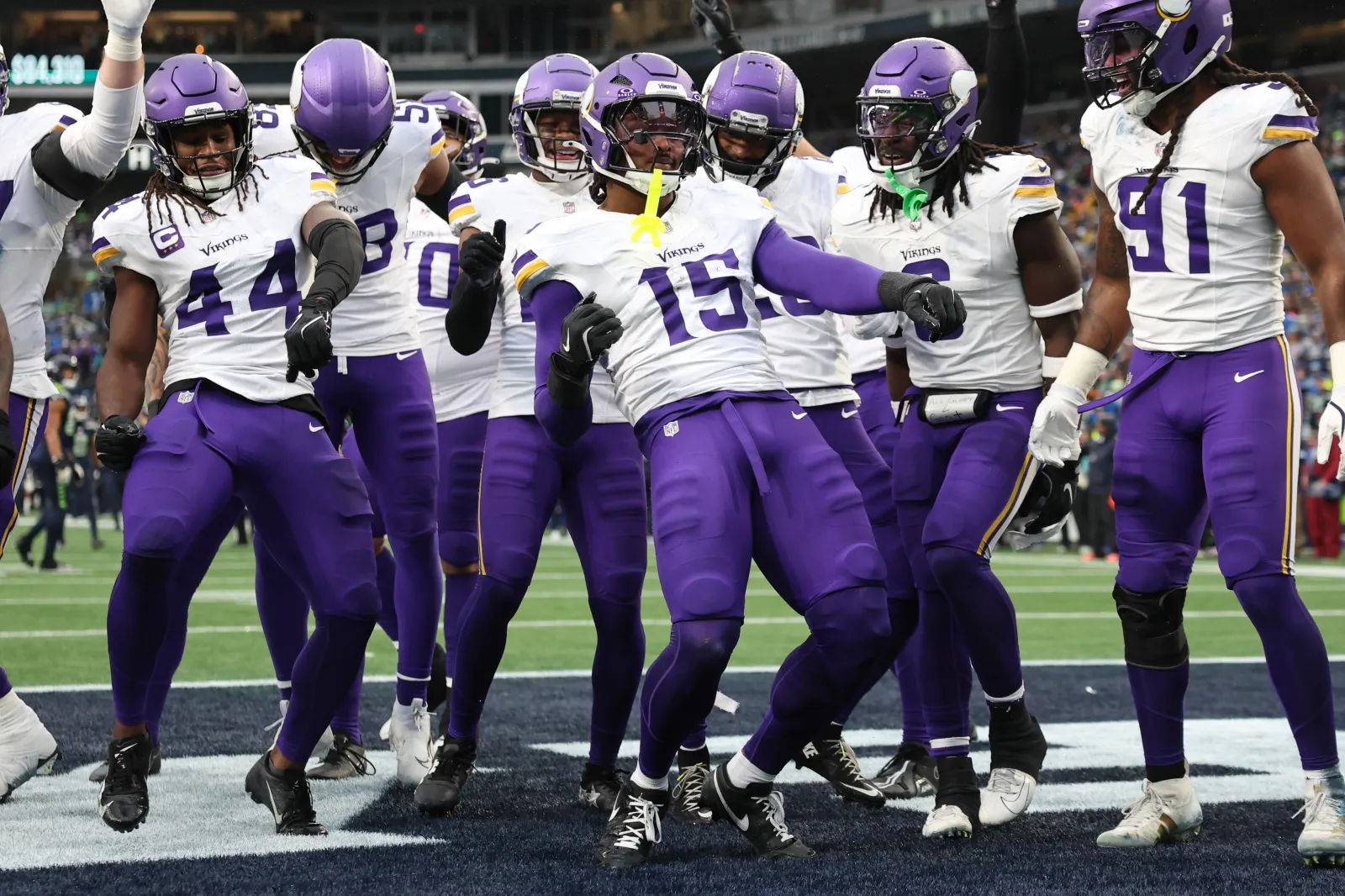 SEATTLE, WASHINGTON - DECEMBER 22: Dallas Turner #15 of the Minnesota Vikings celebrates with teammates after his interception Seahawks during the second quarter at Lumen Field on December 22, 2024 in Seattle, Washington. (Photo by Steph Chambers/Getty Images)
