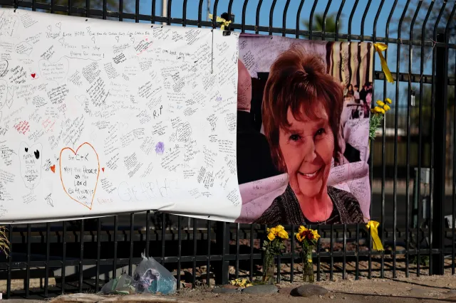A photograph of Nancy Guthrie is seen on a sign that people can leave messages on February 26, 2026, in Tucson, Arizona. Law enforcement officials continue to search for Nancy Guthrie, the 84-year-old mother of U.S. journalist and television host Savannah Guthrie, after she went missing from her home on the morning of February 1.