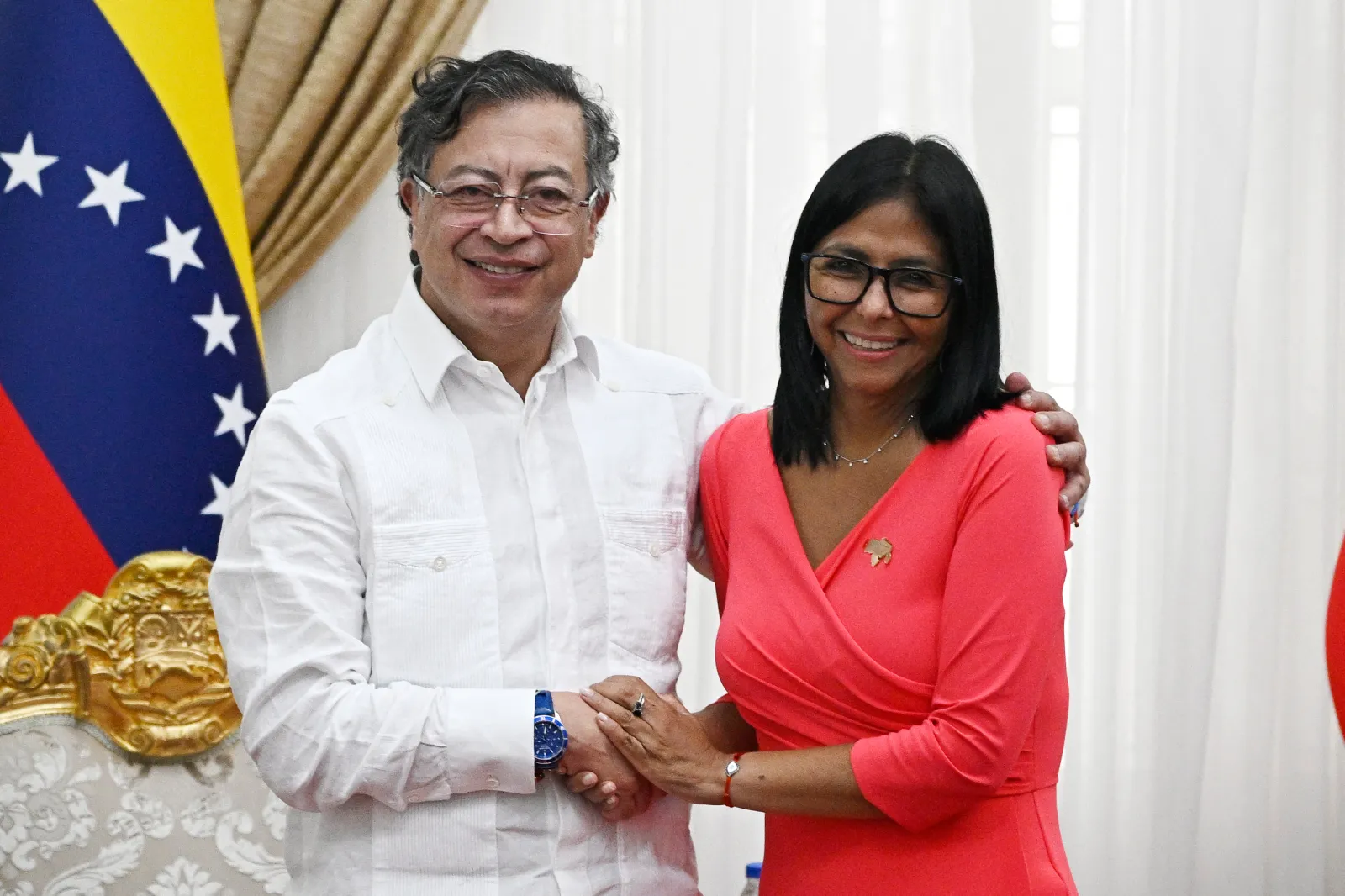 Venezuelan interim President Delcy Rodríguez, right, and Colombian President Gustavo Petro shake hands during a bilateral meeting at the Miraflores Presidential Palace in Caracas on April 24. (Photo by Federico Parra/AFP via Getty Images)