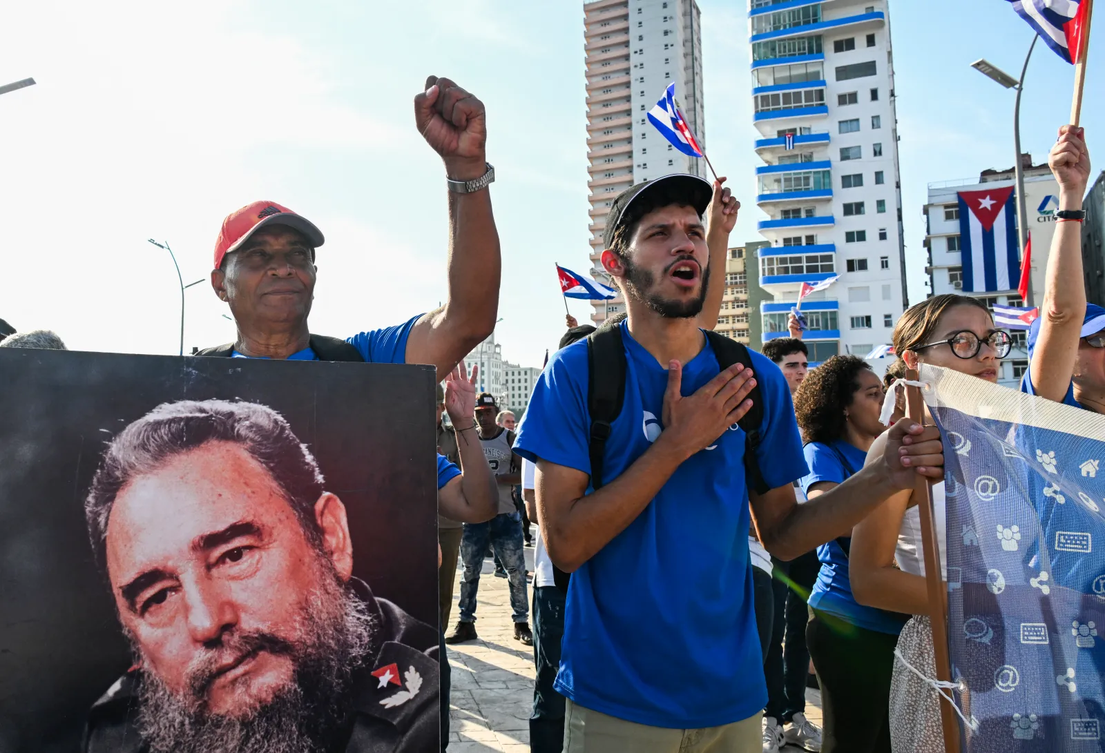 A man holds a poster of iconic Cuban leader Fidel Castro during a march commemorating International Workers' Day, at the Anti-Imperialist Platform in front of the U.S. Embassy in Havana on May 1.