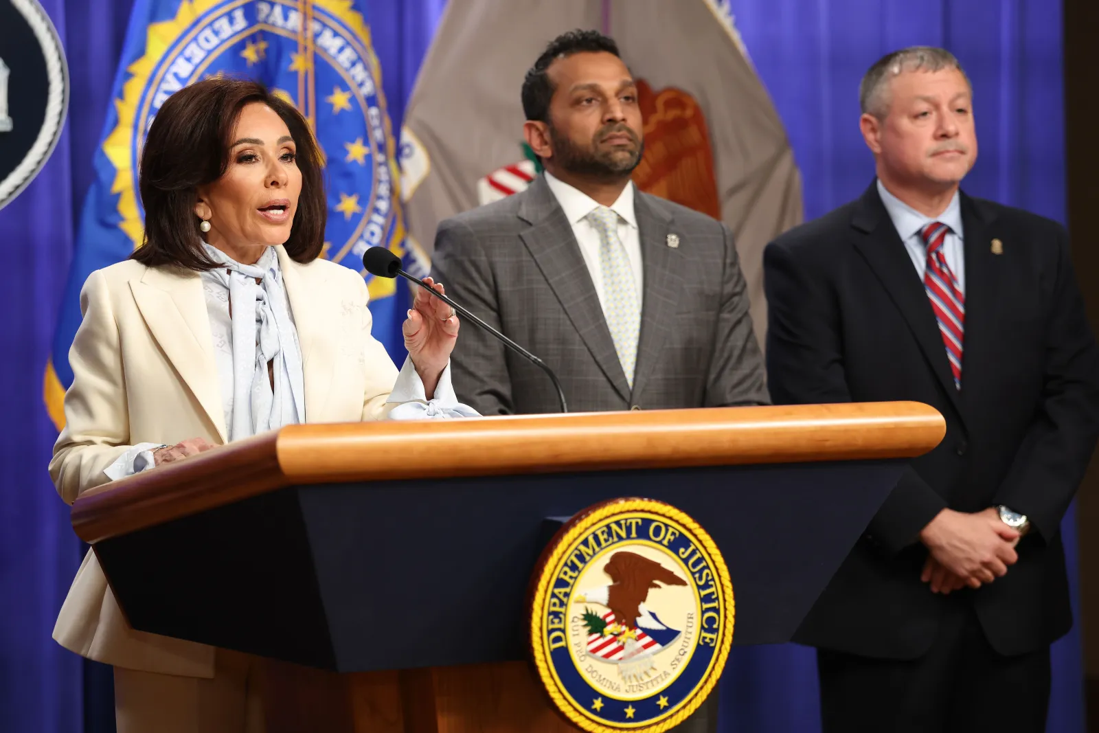 U.S. Attorney for the District of Columbia Jeanine Pirro speaks as FBI Director Kash Patel, center, and acting Assistant Director for the Criminal Investigative Division at the FBI Darren Cox listen at a news conference at the Department of Justice on April 27 in Washington, D.C.