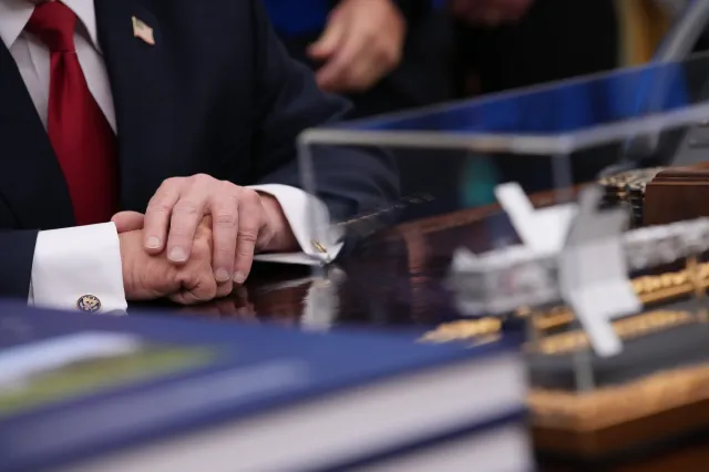 A detailed view of U.S. President Donald Trump's hands during an event with the Artemis II astronauts in the Oval Office of the White House on April 29, 2026 in Washington, DC.