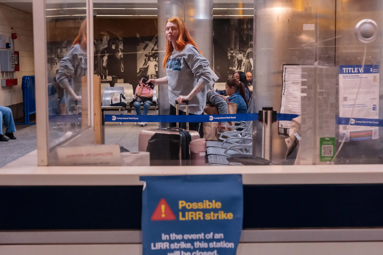 Commuters wait in a waiting area as a sign warns of a possible strike on the Long Island Rail Road (LIRR) at Penn Station on May 15, 2026 in New York City. (Photo by Adam Gray/Getty Images)