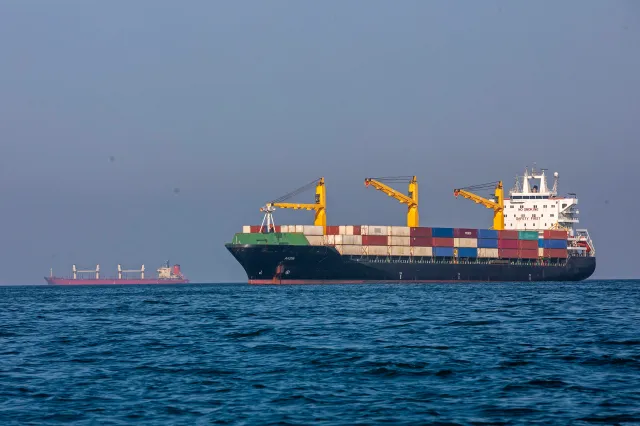 Ships remain anchored on May 16, 2026 in the Strait of Hormuz near Larak Island, Iran.
