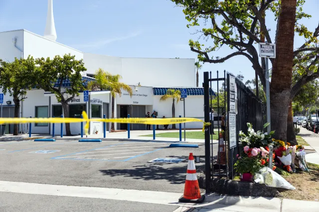 Flowers placed by local residents are seen on May 19, a day after a shooting at the Islamic Center of San Diego in California.