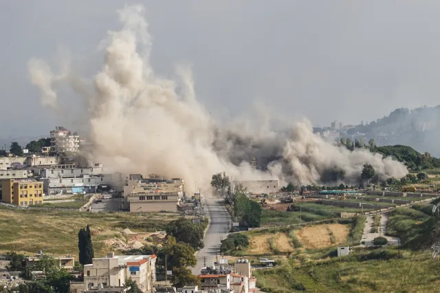 Smoke billows following an Israeli strike on the area of the Rawdat al-Salihin Mosque and the nearby cemetery in the southern city of Nabatieh on May 26.