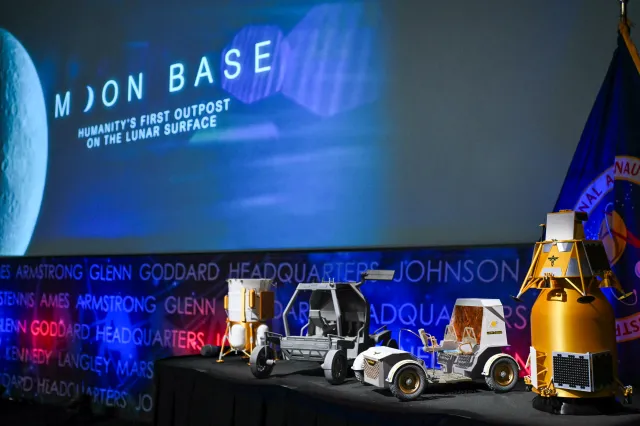 Models of lunar rovers and landers are displayed during a news conference at NASA headquarters in Washington, D.C. on May 26, 2026.
