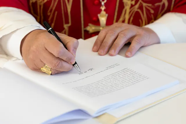 Pope Leo XIV (hands detail) signs
