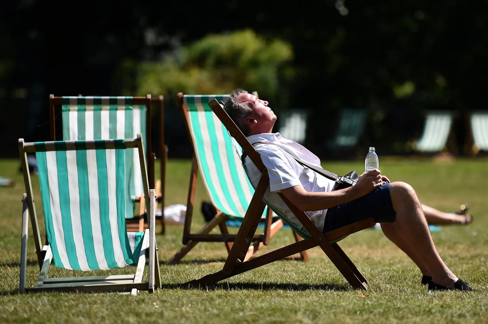 Man rests in a deck chair in central London in July 2014.