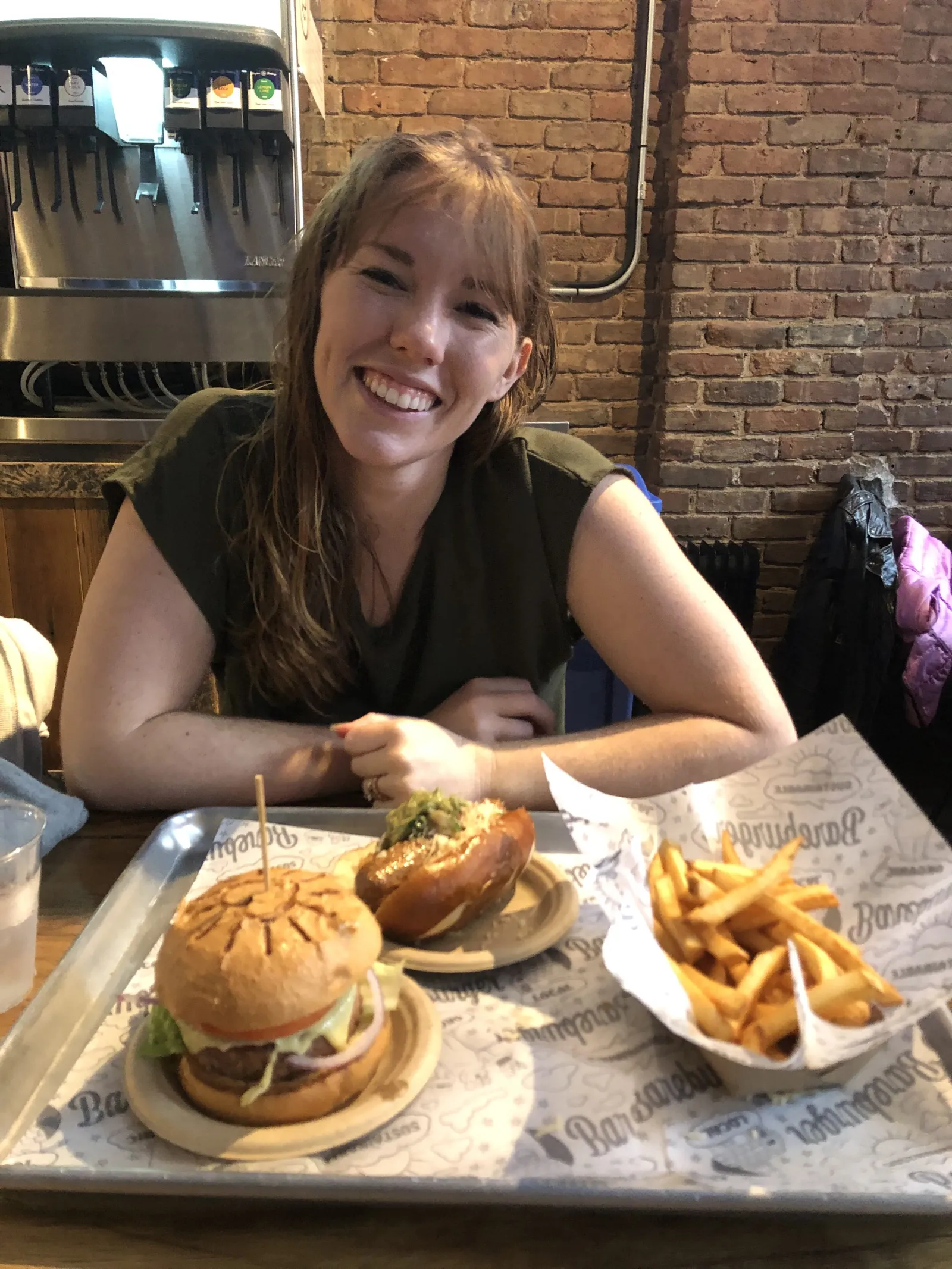 Jillian Pretzel in front of a (vegetarian) burger.
