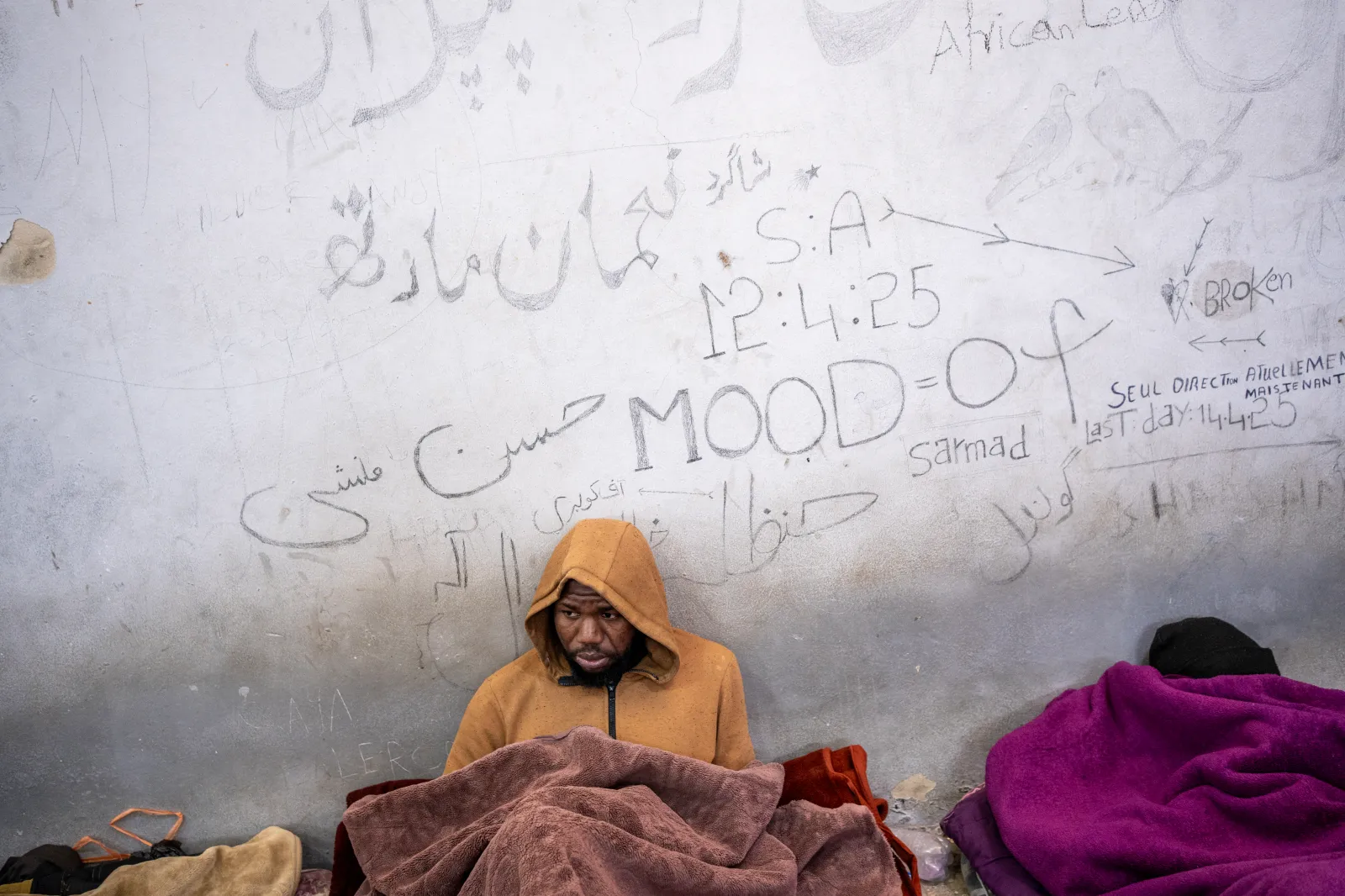 Walls Speak The graffitied walls of the Bir al-Ghanam detention facility in the Zawiya region, an exclusively male center, on April 7. Detainees say they must give guards around $400 for their release.