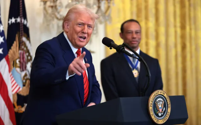 Trump, joined by golf legend Tiger Woods, speaks during a reception honoring Black History Month in the East Room of the White House on February 20, 2025 in Washington, DC.