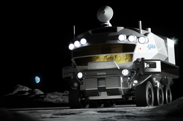 A concept image of JAXA’s pressurized rover is seen as it travels on the surface of the Moon. (JAXA/Toyota)