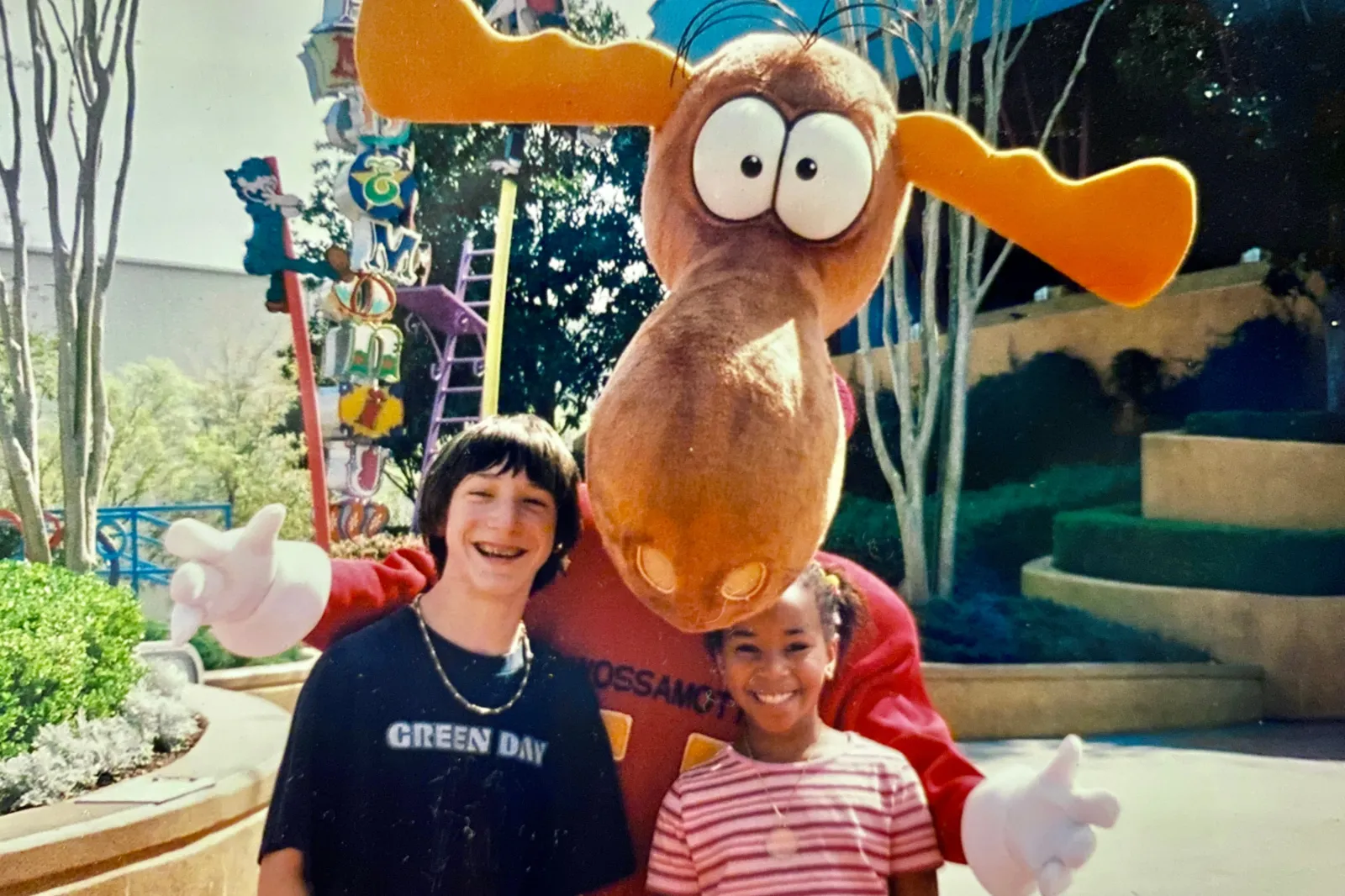 Zack and Jada pose with a person in a moose costume in the family's backyard in Magnolia, Texas.