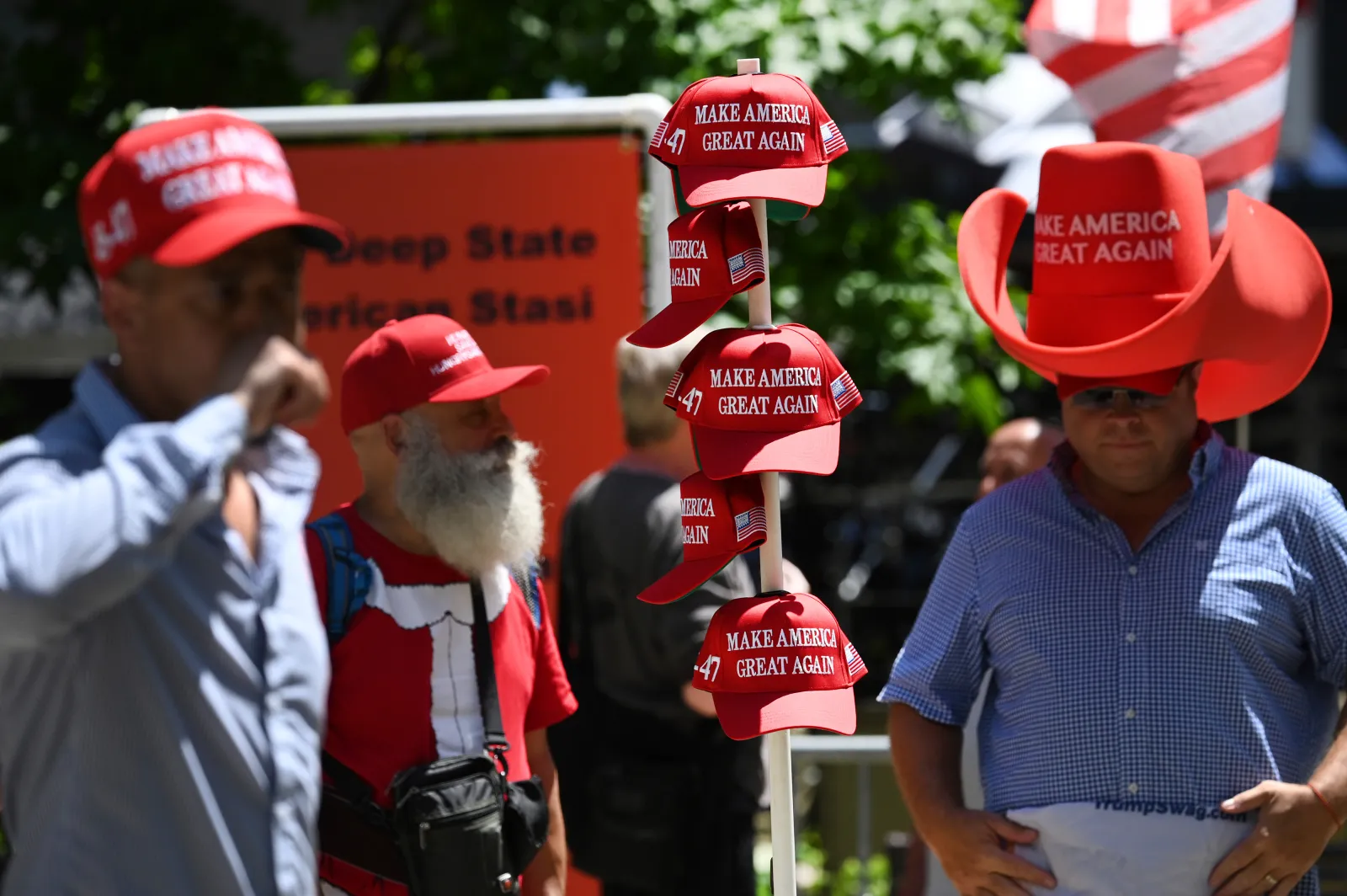 A Trump supporter sets up MAGA hats for sale in Collect Pond Park in New York City on May 28, 2024. (Photo by Anthony Behar/Sipa USA)(Sipa via AP Images)
