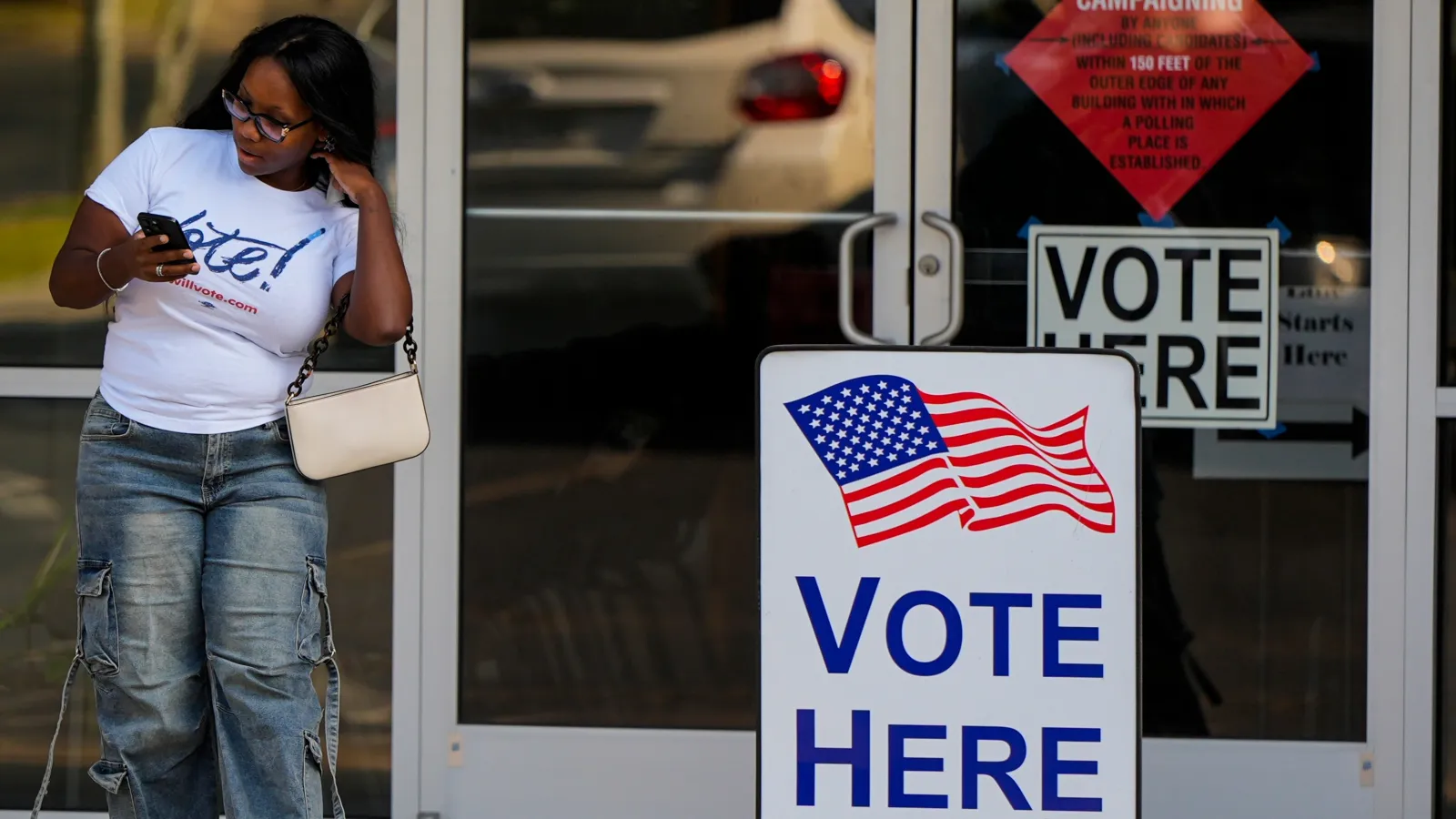 A woman leaves a voting center on May 19 in Marietta, Georgia. (AP Photo/Mike Stewart)