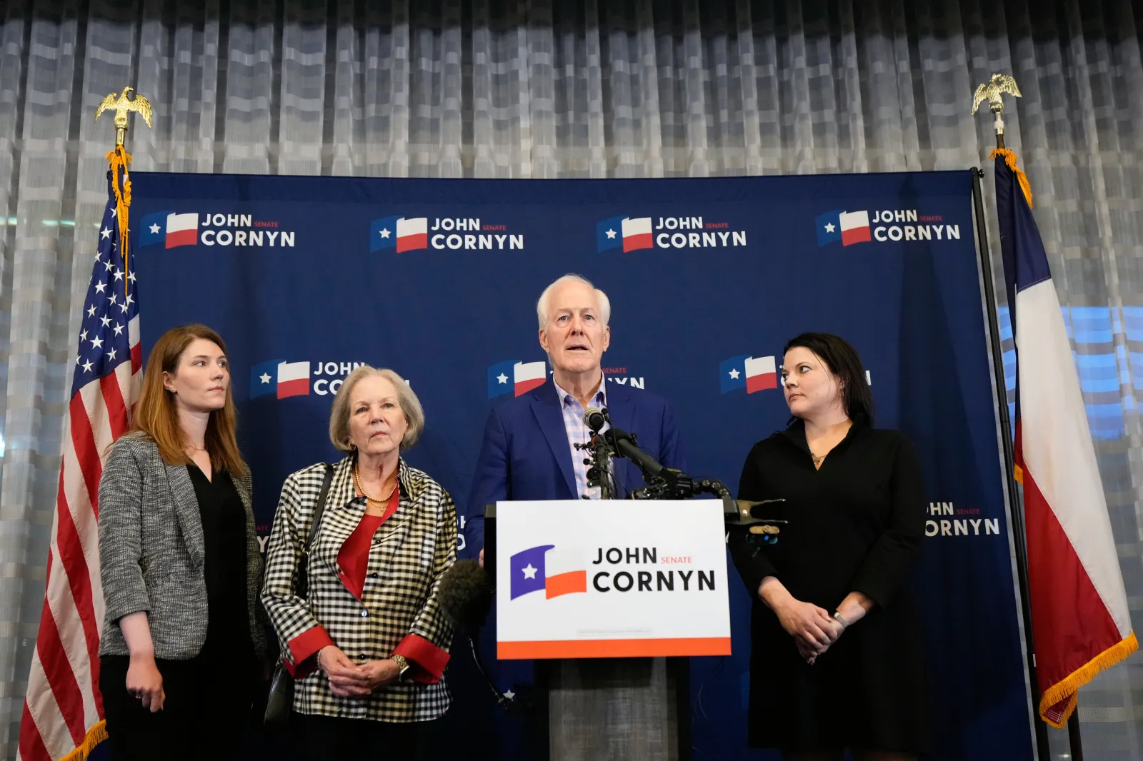 Sen. John Cornyn, R-Texas, center right, speaks alongside, from left, daughter Danley Cornyn, wife Sandy Cornyn and daughter Haley Cornyn, during a primary runoff election night event after losing the Republican party's nomination on May 26, 2026, in Austin.