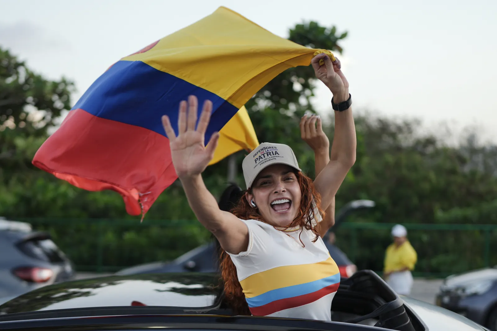 Supporters of presidential candidate Abelardo de la Espriella of the Defenders of the Motherland movement celebrate after the candidate advanced to a runoff election in Barranquilla, Colombia, on May 31.