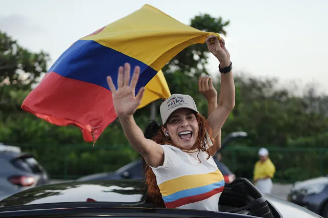 Supporters of presidential candidate Abelardo de la Espriella of the Defenders of the Motherland movement celebrate after the candidate advanced to a runoff election in Barranquilla, Colombia, on May 31.