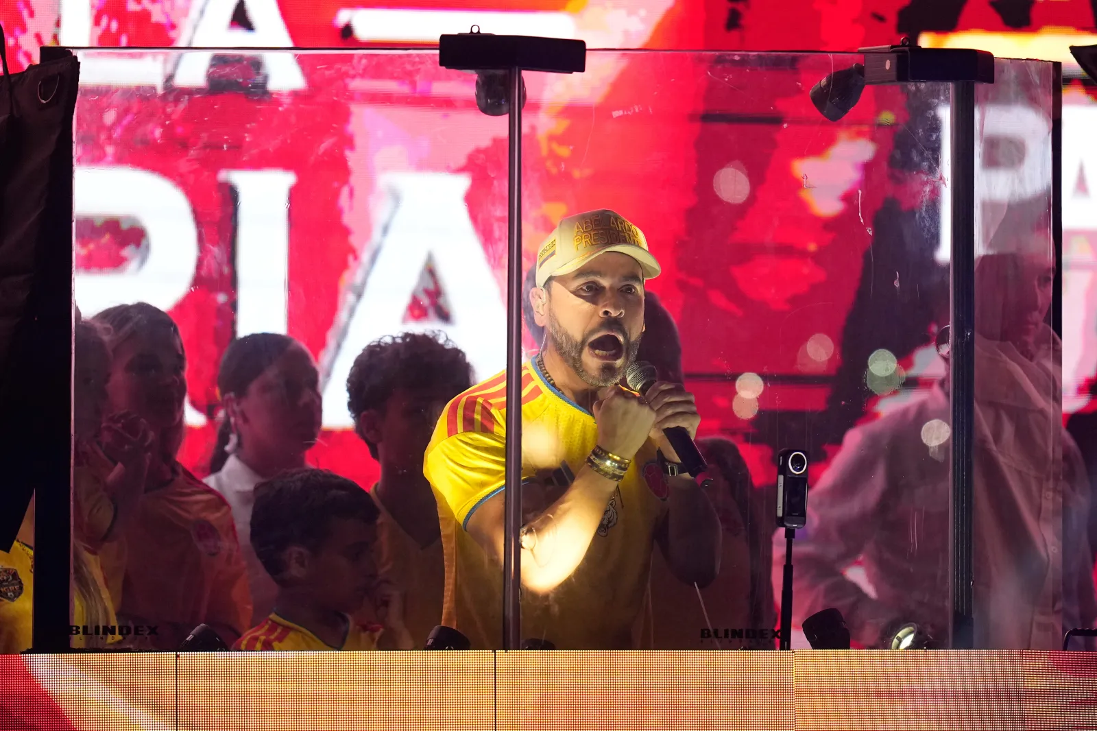 Presidential candidate Abelardo de la Espriella of the Defenders of the Motherland movement addresses supporters from inside a bulletproof booth after leading the first round of the presidential election and advancing to a runoff in Barranquilla, Colombia, on May 31.