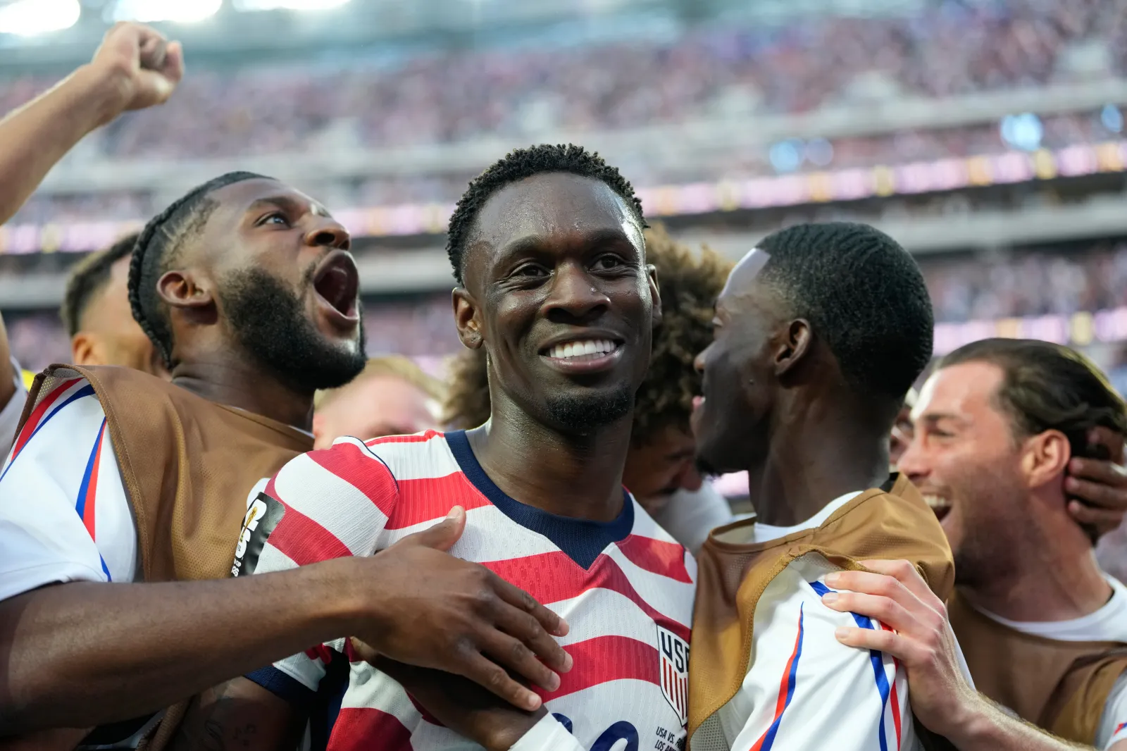 United States' Folarin Balogun, center, celebrates scoring his side's third goal against Paraguay with teammates during the World Cup Group D soccer match in Inglewood, California, on June 12. (AP Photo/Andre Penner)