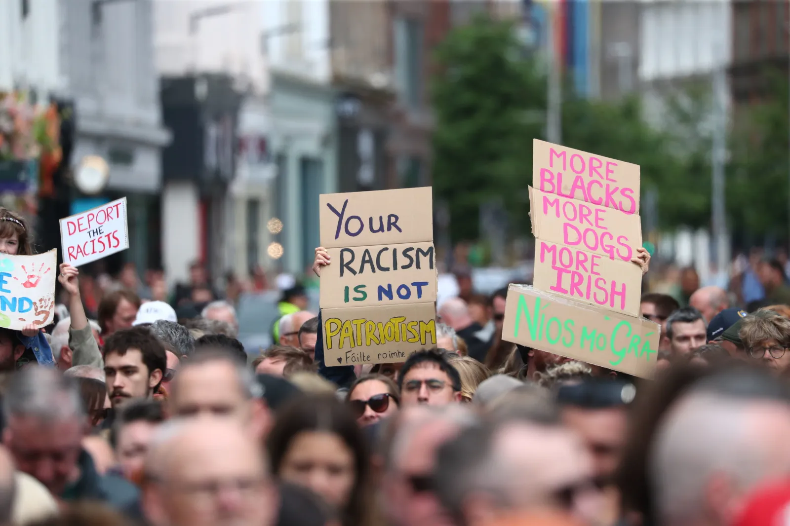 People gather during an anti-racism rally outside Belfast City Hall sparked by a knife attack on a man in north Belfast on Monday in Belfast on June 13. (Peter Morrison/PA via AP)