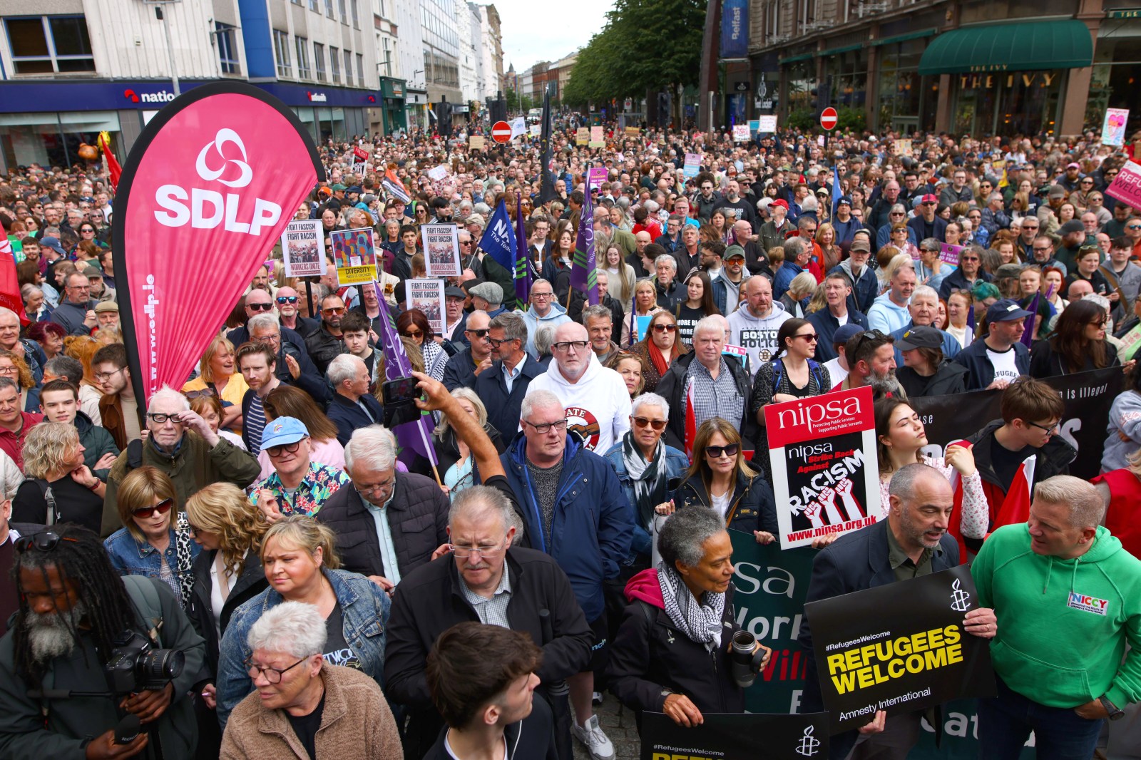 Thousands Rally in Rome and Belfast as EU Migration Pact Takes Effect