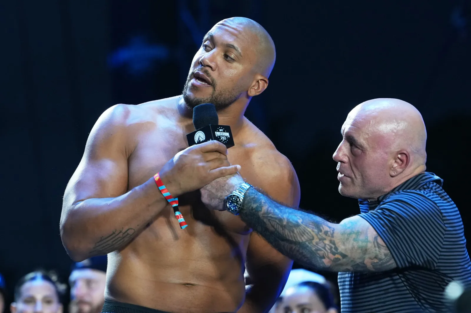 UFC commentator Joe Rogan, right, speaks with Ciryl Gane, during the ceremonial UFC Freedom 250 weigh-ins on the Ellipse on June 13, 2026, in Washington, ahead of Sunday's fight on the South Lawn of the White House.
