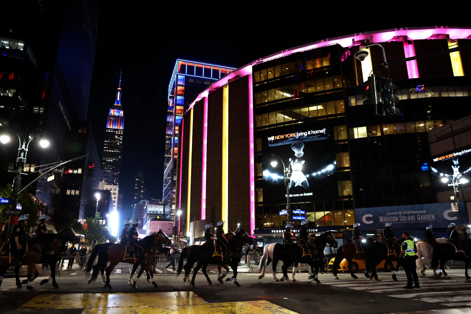 New York City police on horseback patrol the street by Madison Square Garden in New York during Game 5 of the NBA Finals basketball series on June 13, 2026.
