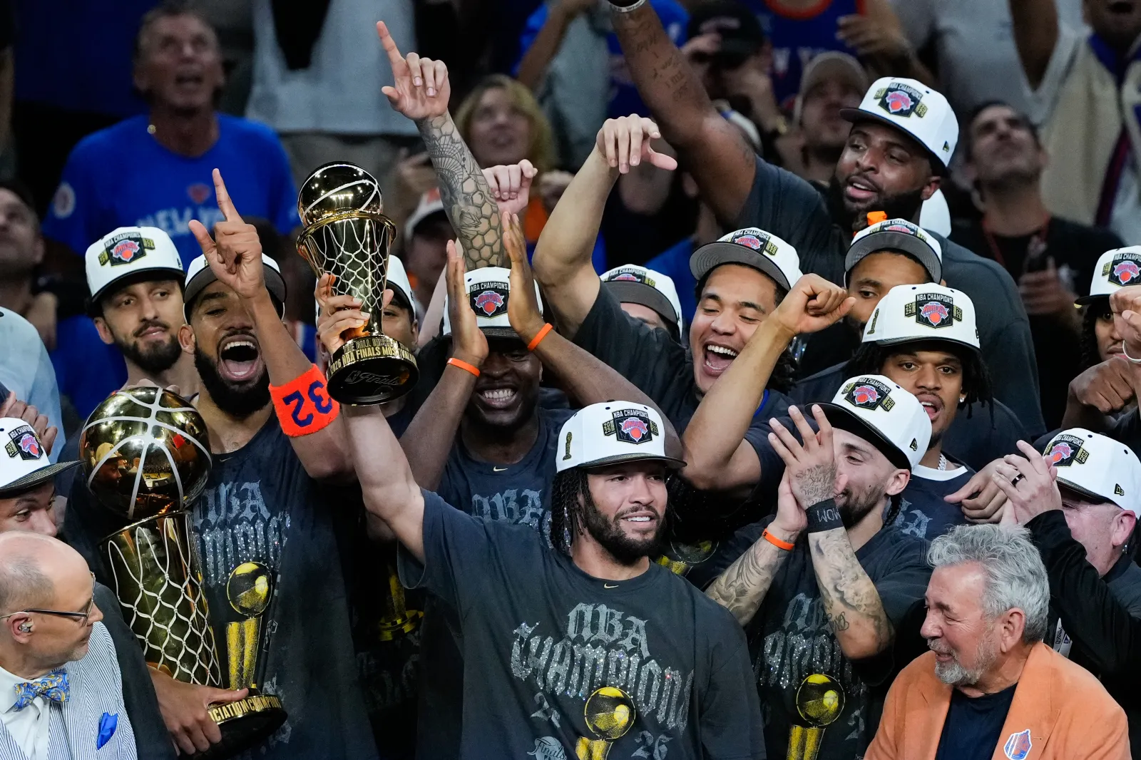New York Knicks superstar guard Jalen Brunson, front and center, holds the MVP trophy after the Knicks defeated the San Antonio Spurs in Game 5 of the NBA Finals on Saturday in Texas. (AP Photo/Ross D. Franklin)