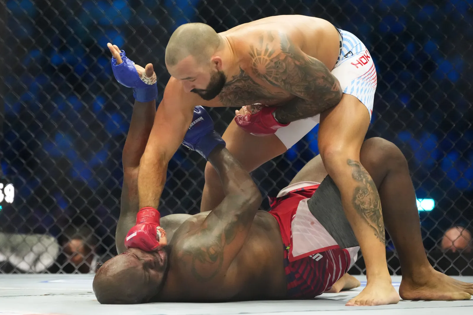 Josh Hokit lands a punch on Derrick Lewis during their heavyweight bout at UFC Freedom 250, the White House, Sunday, June 14, 2026.
