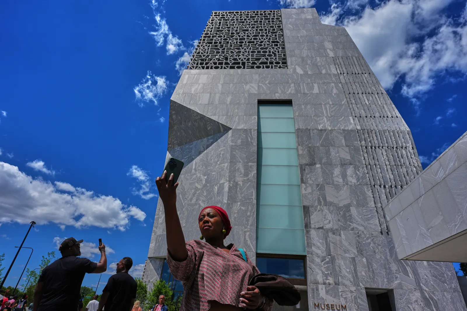 Belinda Chanda from Zambia, takes a selfie in front of the museum building at the Obama Presidential Center, on June 19 in Chicago. (AP Photo/Nam Y. Huh)
