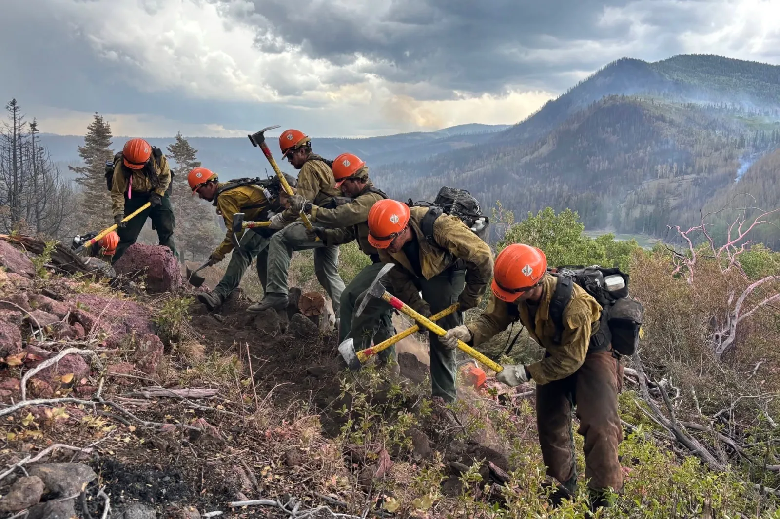 This image provided by the U.S. Forest Service shows firefighters responding to the Cottonwood Fire on June 24 above Birch Lake, near Beaver, Utah. (Mike McMillan/U.S. Forest Service via AP)
