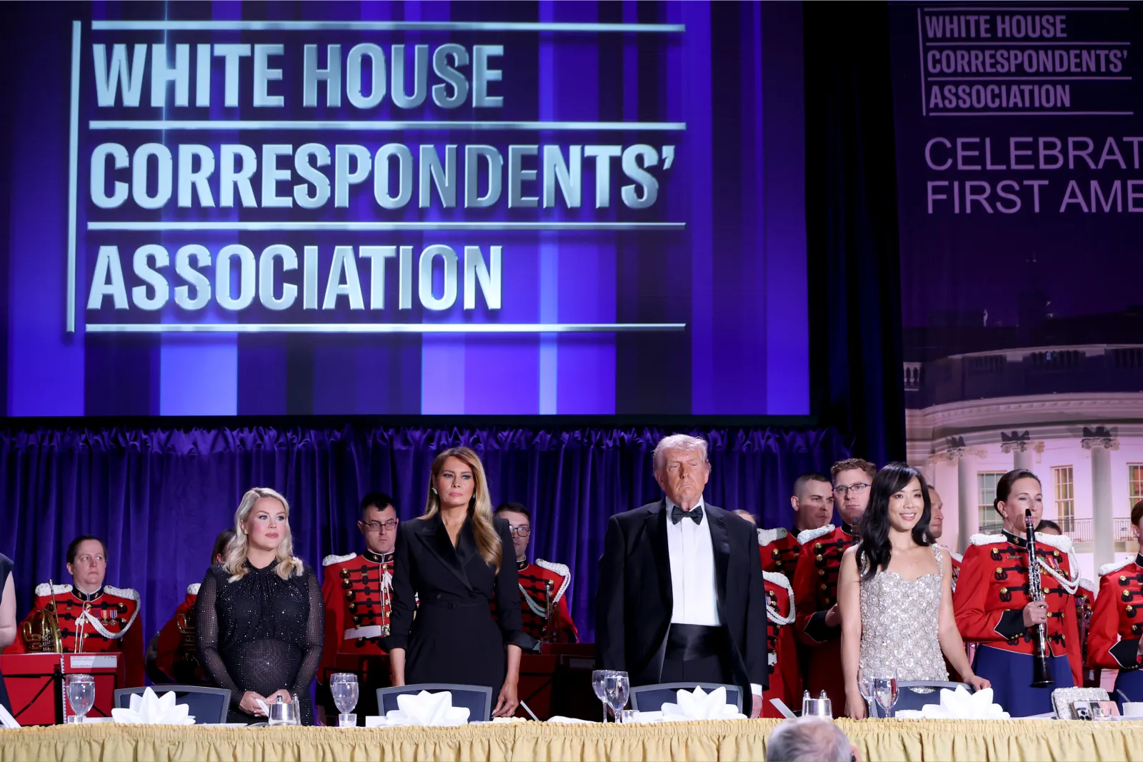 Karoline Leavitt, Melania Trump, Donald Trump, and Weijia Jiang stand at The White House Correspondents Dinner, April 25, 2026.