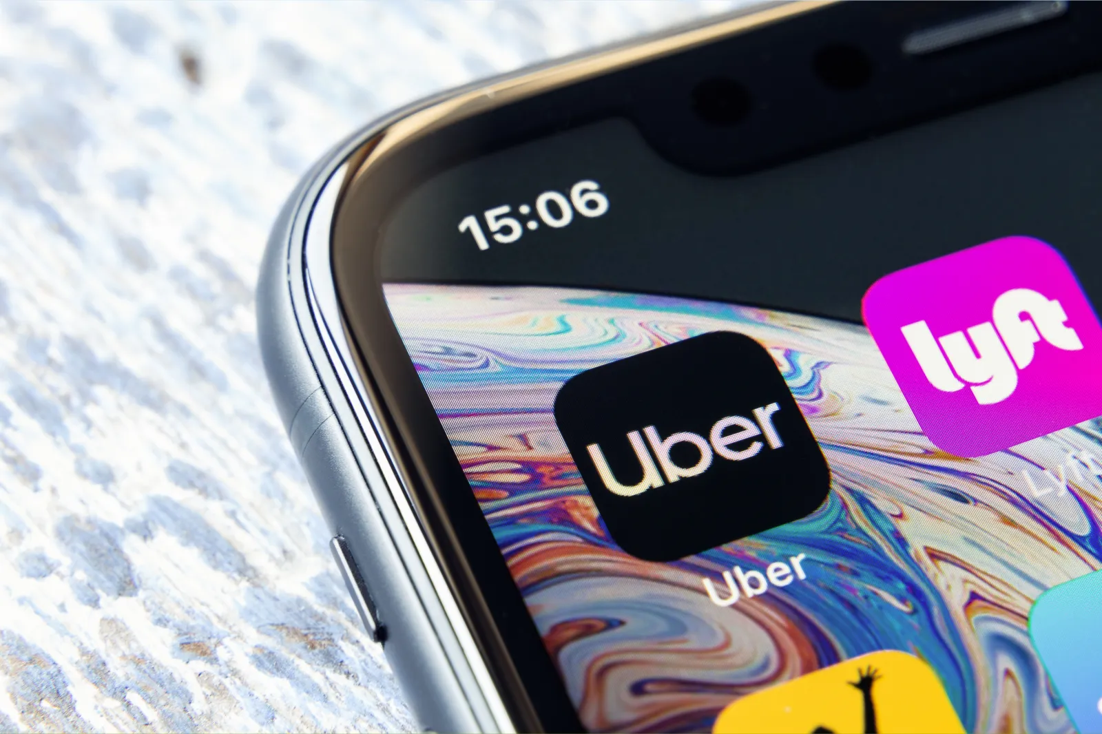 Mobile apps for Lyft and Uber on an iPhone.