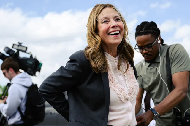 Dr. Amy Acton, Ohio Democratic gubernatorial candidate and former director of the Ohio Department of Health, is fitted with a microphone during a rally on April 28, 2026 in Cincinnati, Ohio.