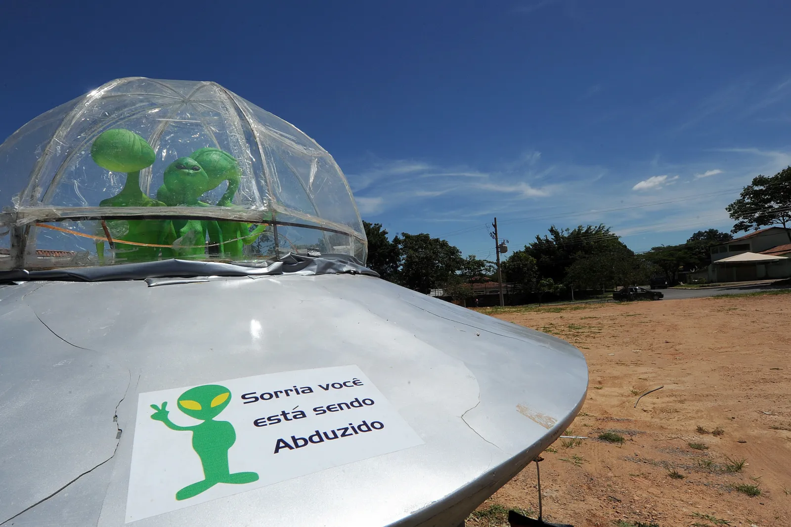 A mock UFO with alien dolls and reading "Smile, you are being abducted" is seen in Alto Paraiso town, Goias State, 230 kms north of Brasilia, on December 20, 2012.