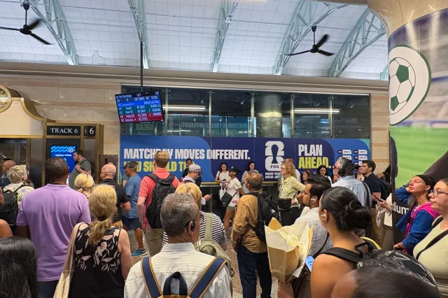 FIFA World Cup 2026 branding and passenger advisory messages to plan ahead with travel arrangements are seen as commuters wait at a packed New York Penn Station as trains are delayed and cancelled on June 11, 2026 in New York, New York.