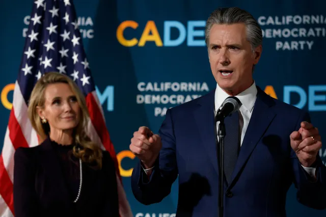 California Gov. Gavin Newsom (R) speaks as his wife Jennifer Siebel Newsom (L) looks on during an election night gathering at the California Democrats headquarters on November 04, 2025 in Sacramento, California.