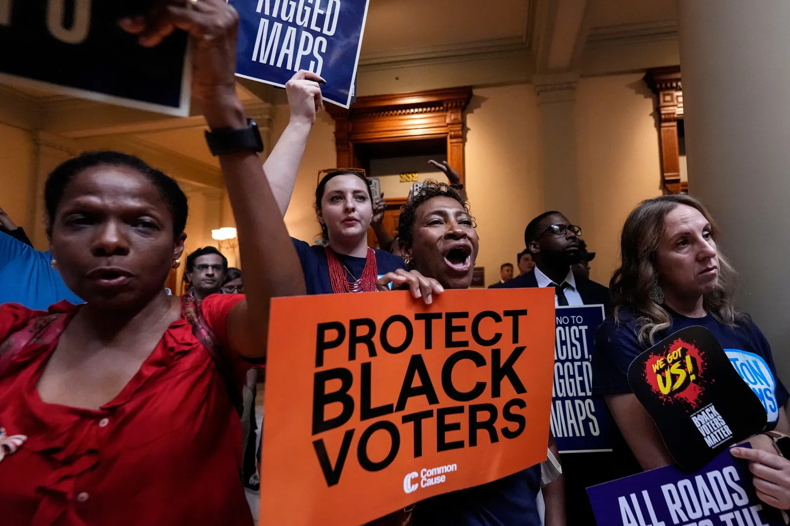 People listen and cheer as lawmakers speak about redistricting during a special legislative session at the state capitol, Wednesday, June 17, 2026, in Atlanta.