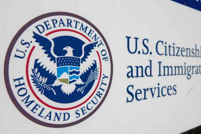 The U.S. Department Of Homeland Security logo is displayed on a sign at a Citizenship and Immigration Services office on January 16, 2026 in San Diego, CA.