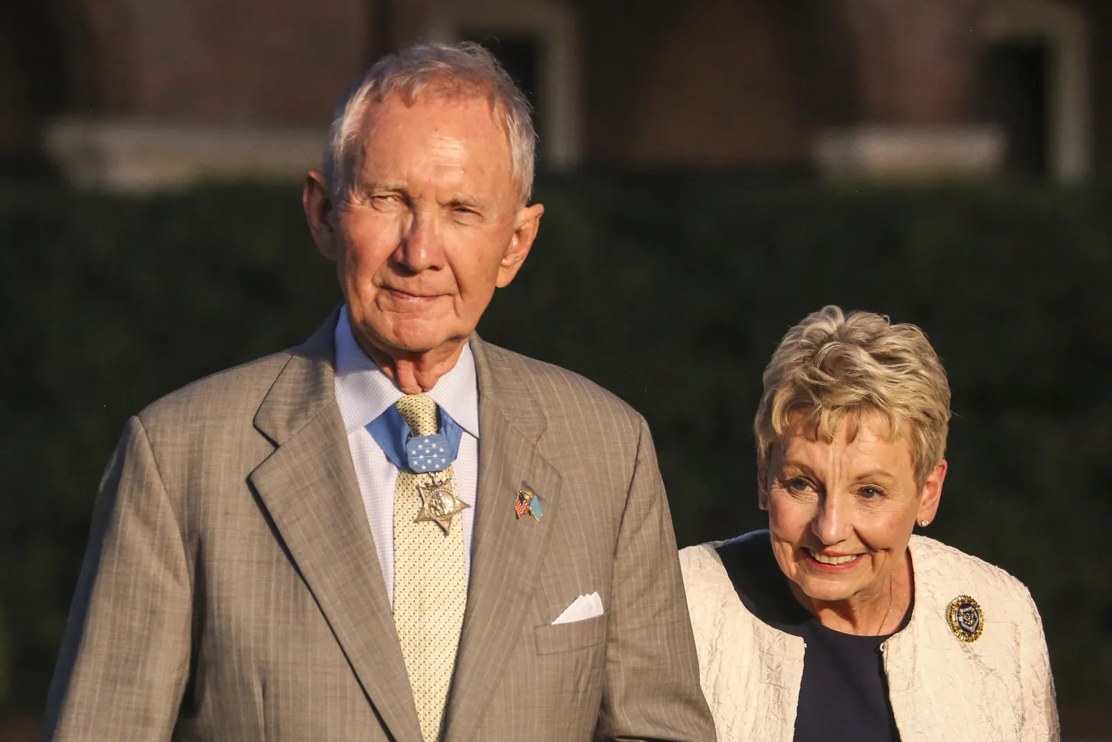 Major Gen James E Livingston, Medal of Honor recipient, and his wife, Sara Livingston, walk down Center Walk, during a Friday Evening Parade at Marine Barracks Washington DC, July 20, 2018. Image courtesy Lance Cpl. Damon Mclean/Marine Barracks Washington, 8th.