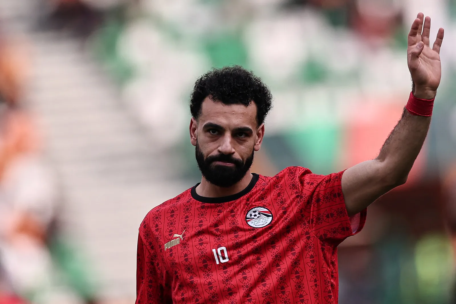 TOPSHOT - Egypt's forward #10 Mohamed Salah waves as he warms up prior to the Africa Cup of Nations (CAN) 2024 group B football match between Egypt and Mozambique at the Felix Houphouet-Boigny Stadium in Abidjan on January 14, 2024. (Photo by FRANCK FIFE / AFP) (Photo by FRANCK FIFE/AFP via Getty Images)